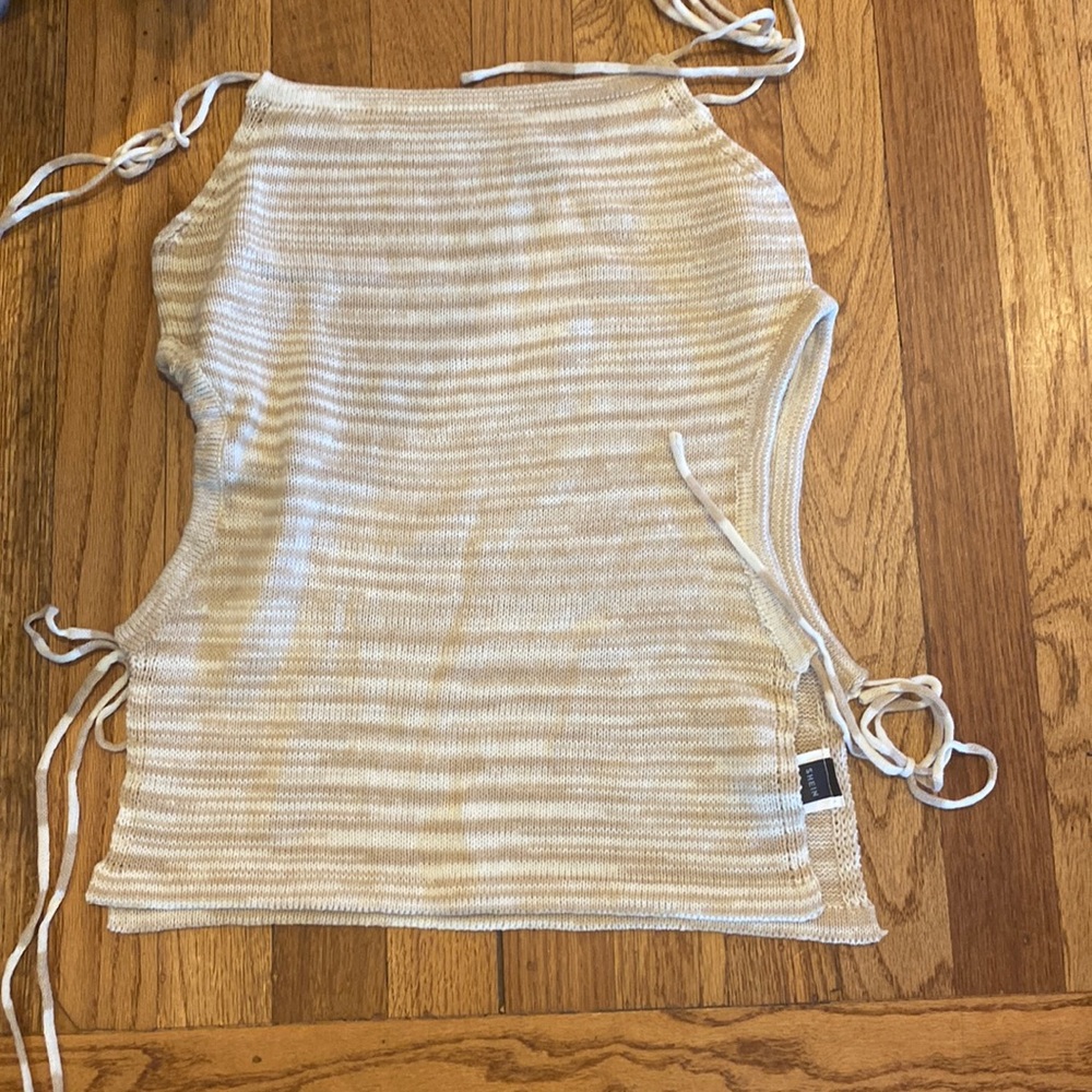 This knit adjustable top is perfect for the upcoming summer season.